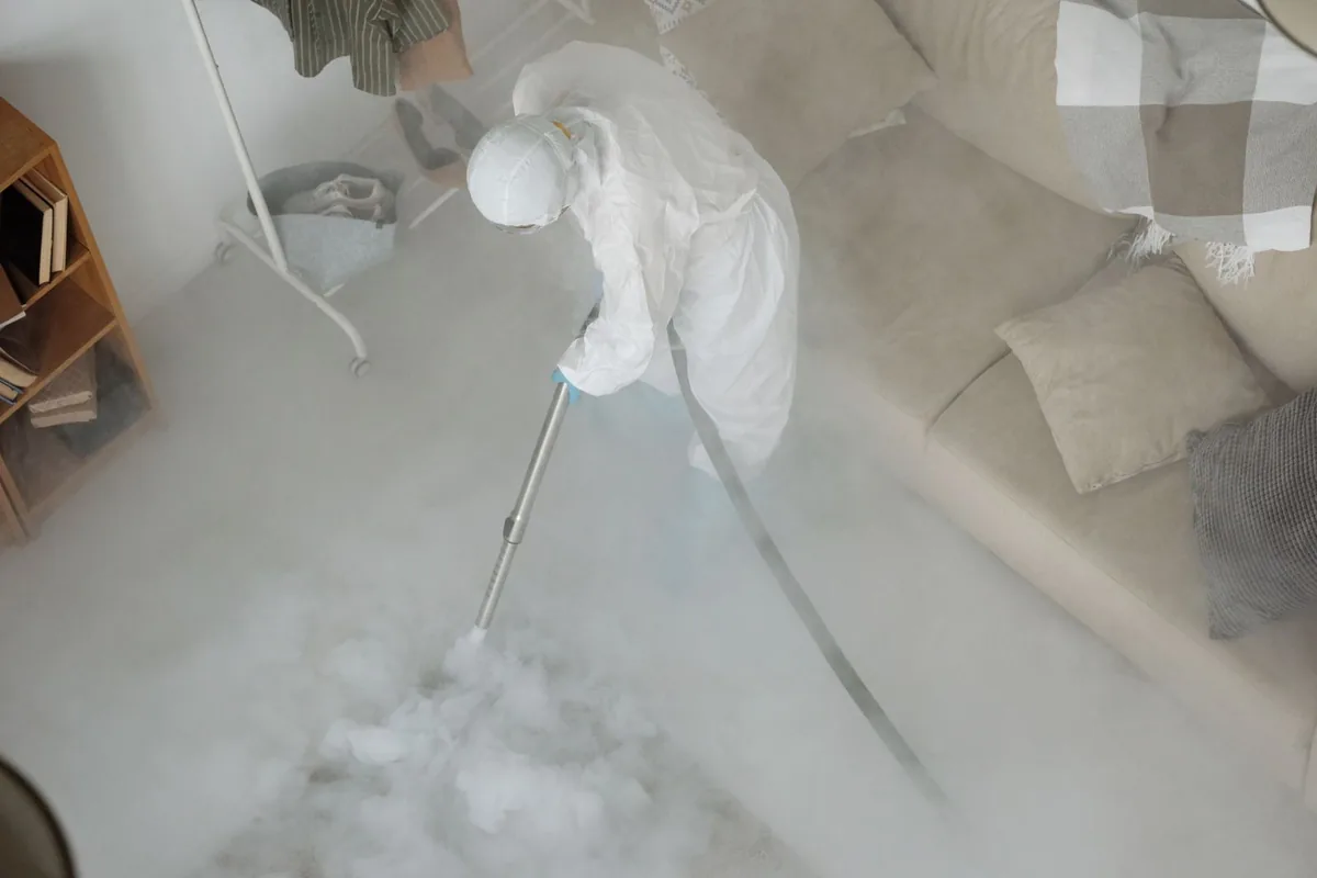 Biohazard cleanup technician in protective equipment, Orange, OH